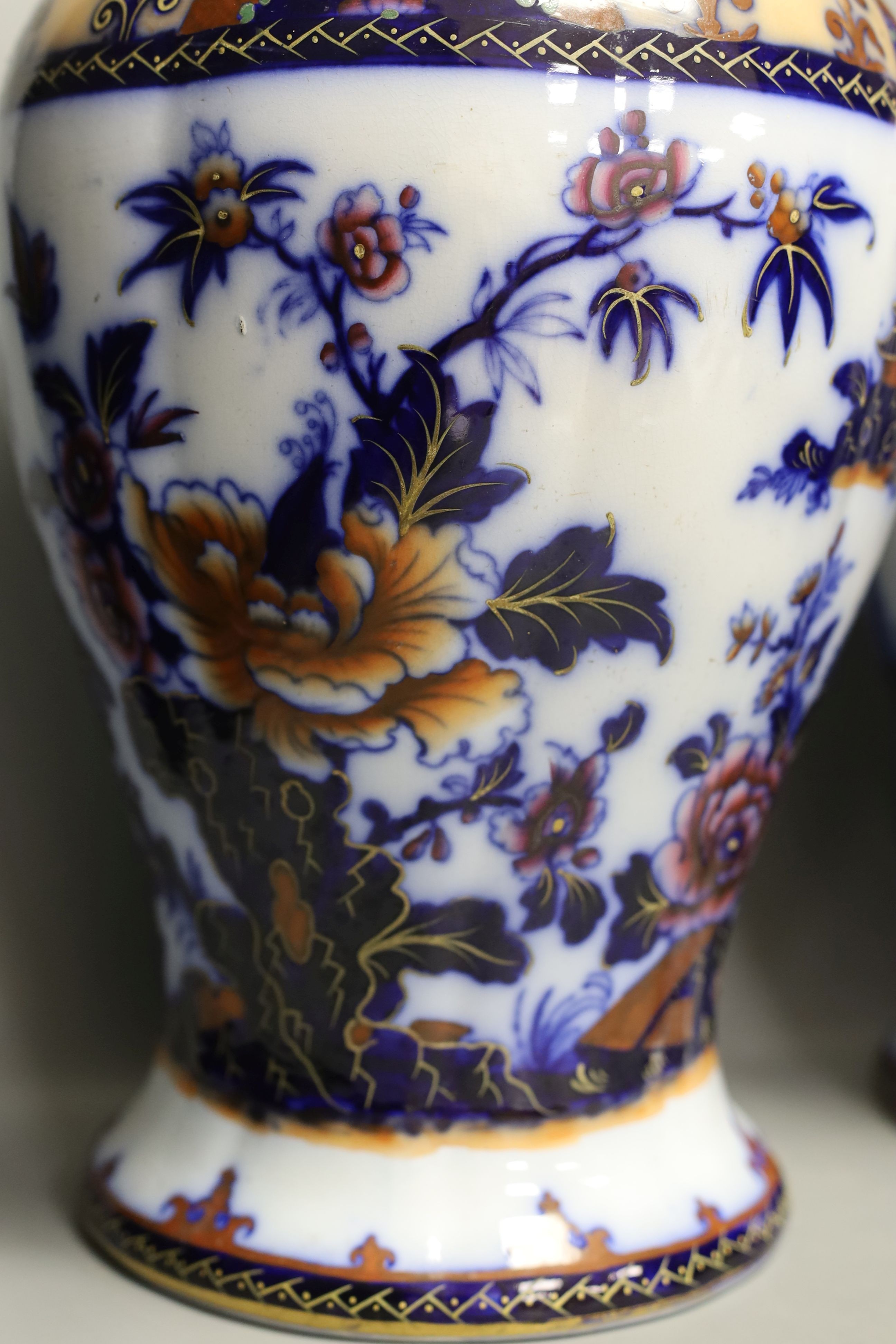 A pair of mid 19th century ironstone vases and covers - 51cm tall